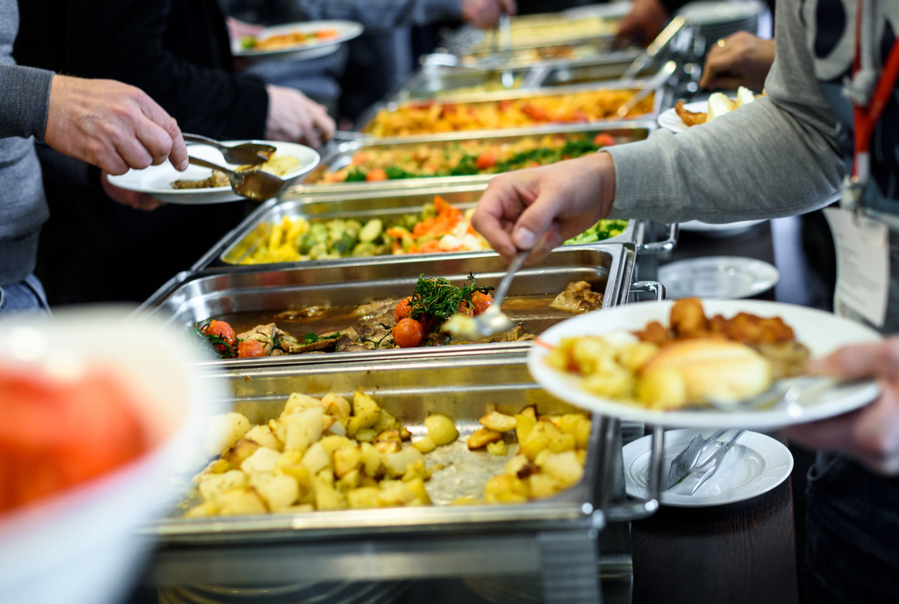 Cuisine Culinary Buffet Dinner Catering Dining Food Celebration Party Concept. Group of people in all you can eat catering buffet food indoor in luxury restaurant with meat and vegetables.